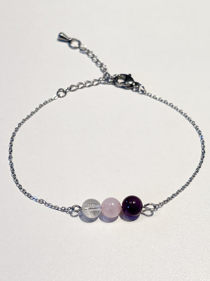 Bracelet énergétique en quartz rose, cristal de roche et améthyste : apaisement et harmonie